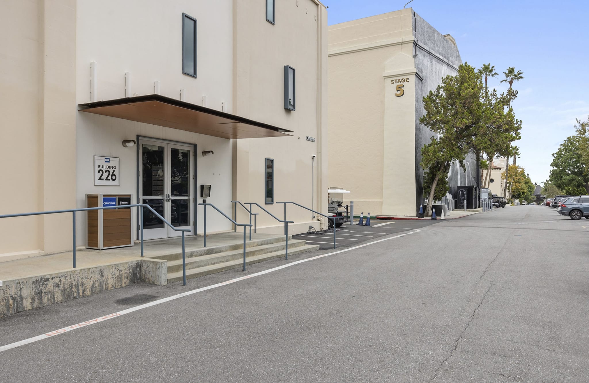 A street on a studio lot with Building 226 and Stage 5 visible.